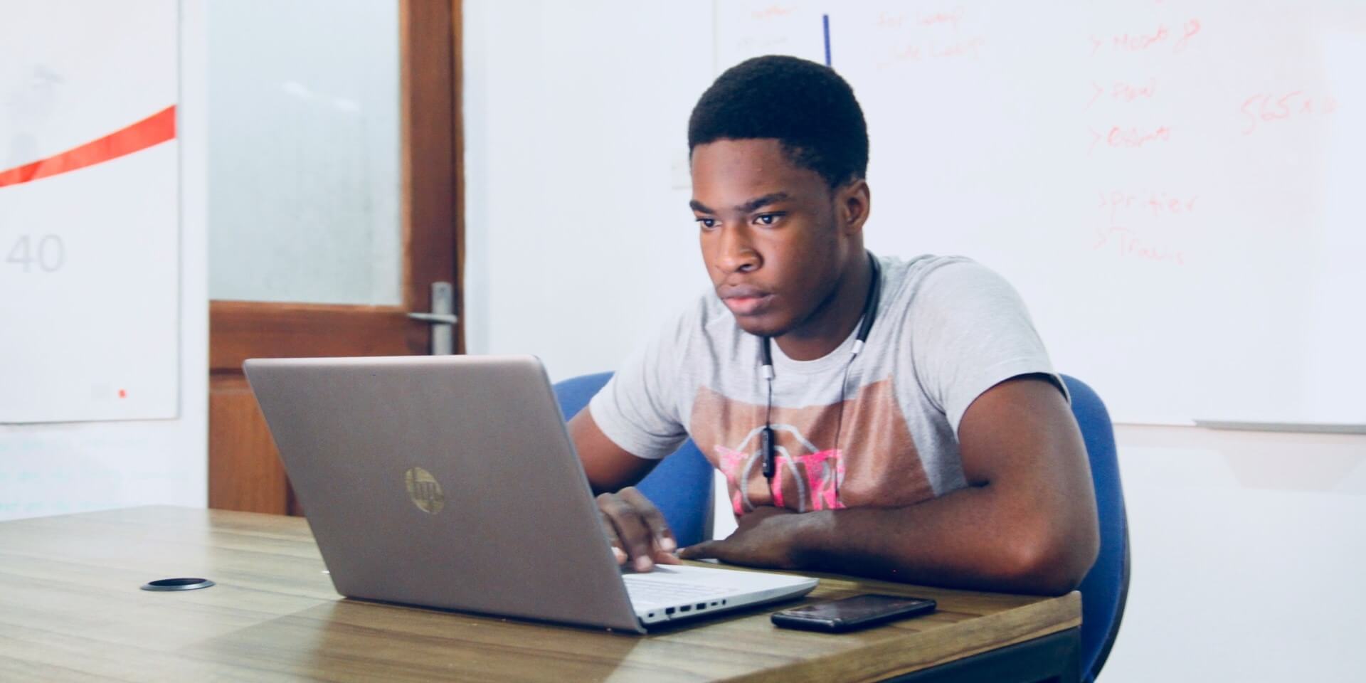 student studying on a laptop