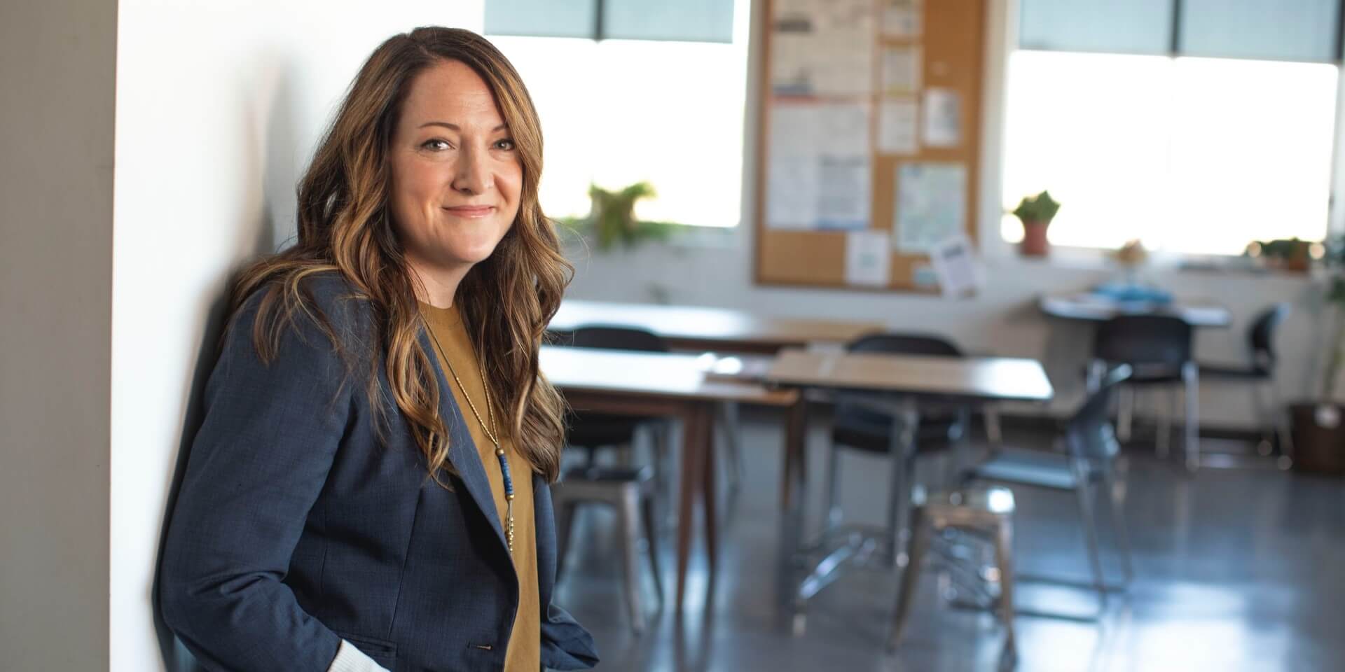 CTE teacher standing outside a classroom