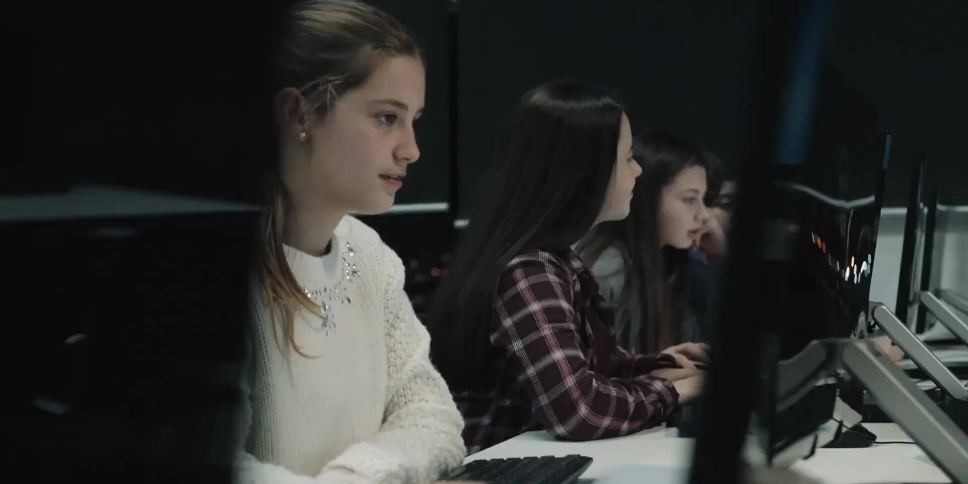 a row of students using computers