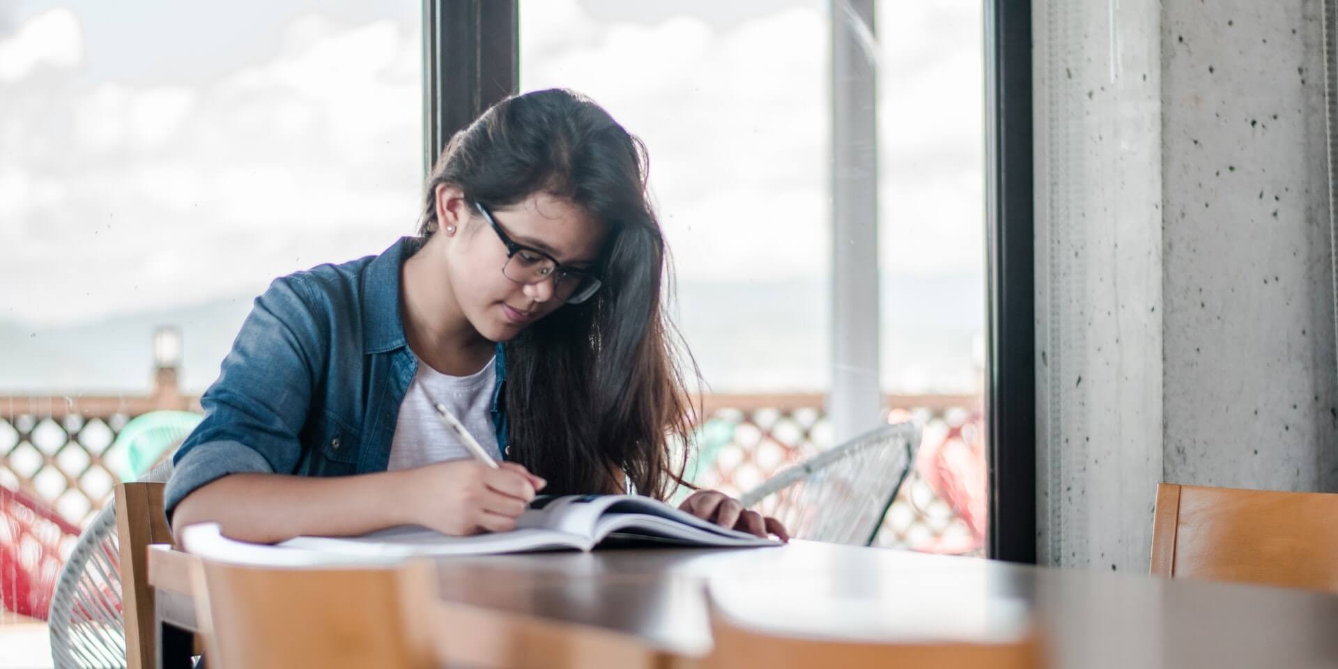 a student studying at a table