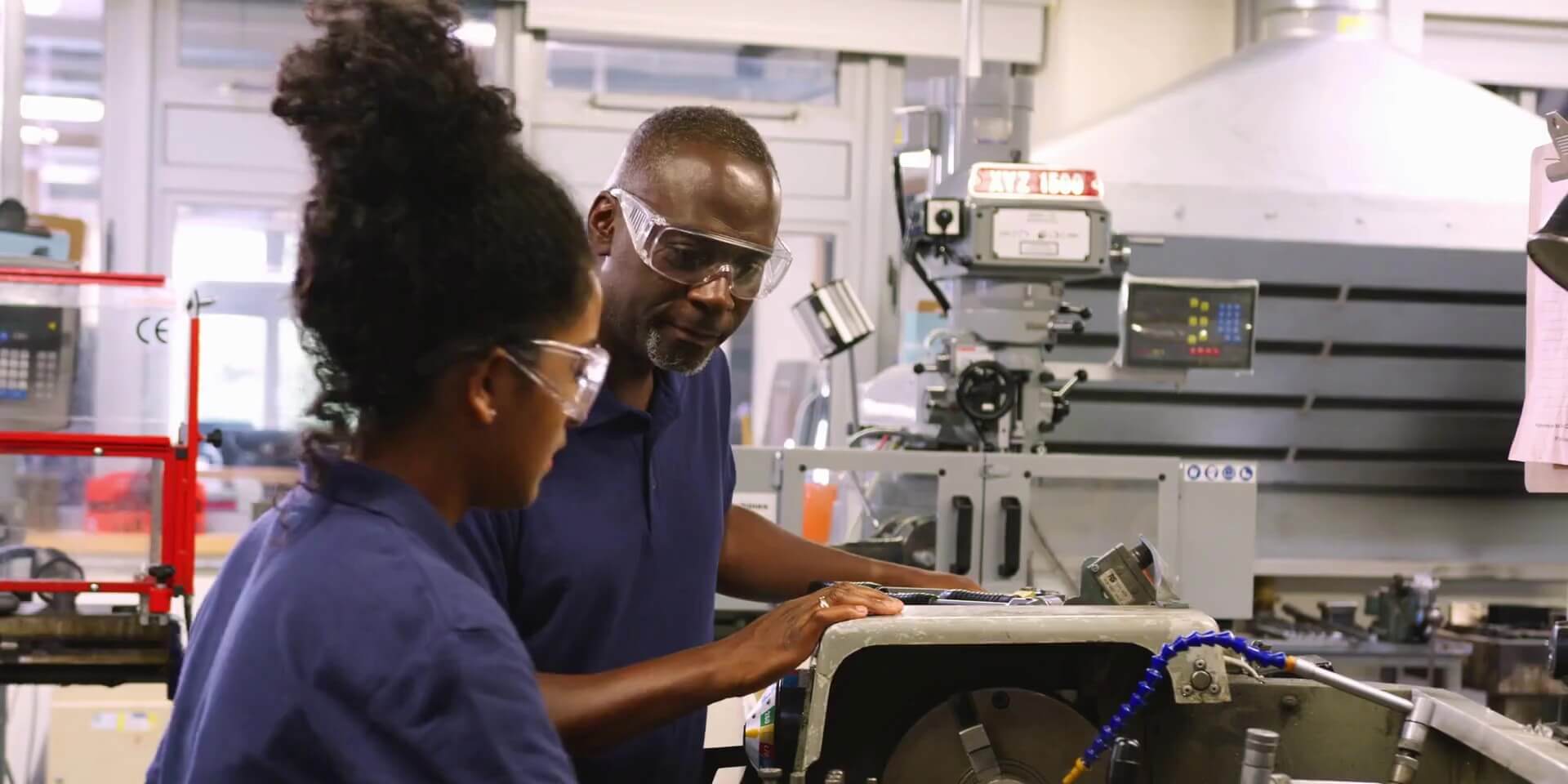 CTE teacher helps a student