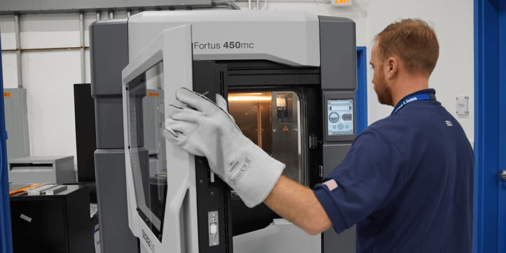 technician working on a 3D printer