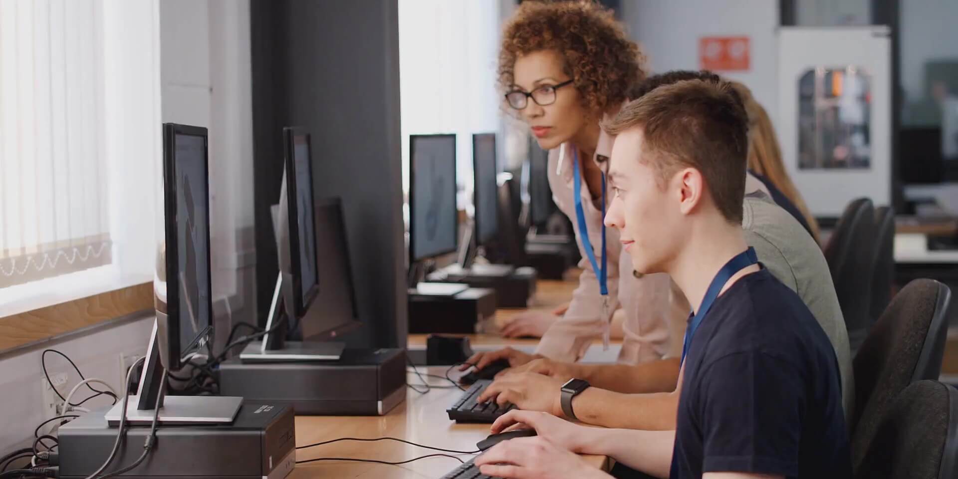 teacher helping student with pre-testing