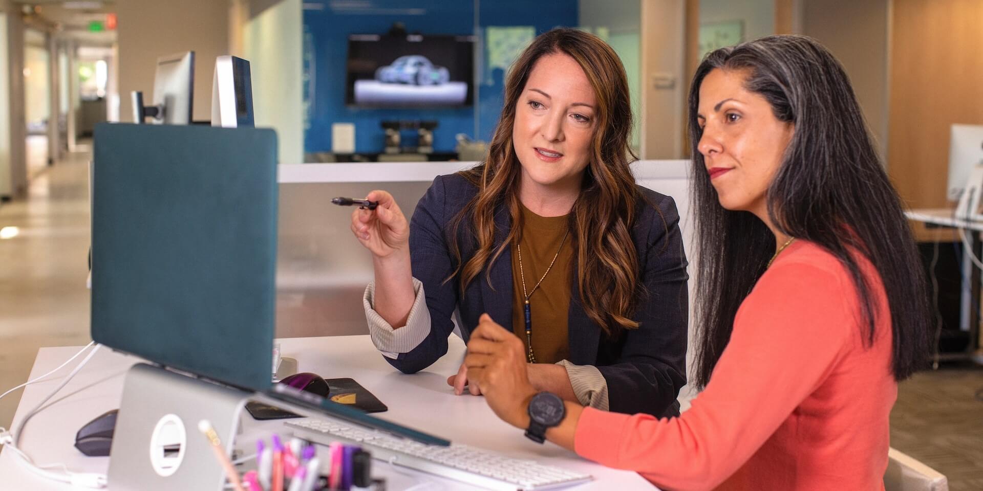 two cte professionals working together at a computer